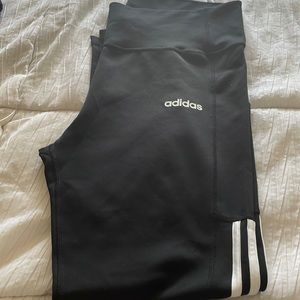 Adidas tights with side pockets. White stripes down the side. Worn once, US Xl